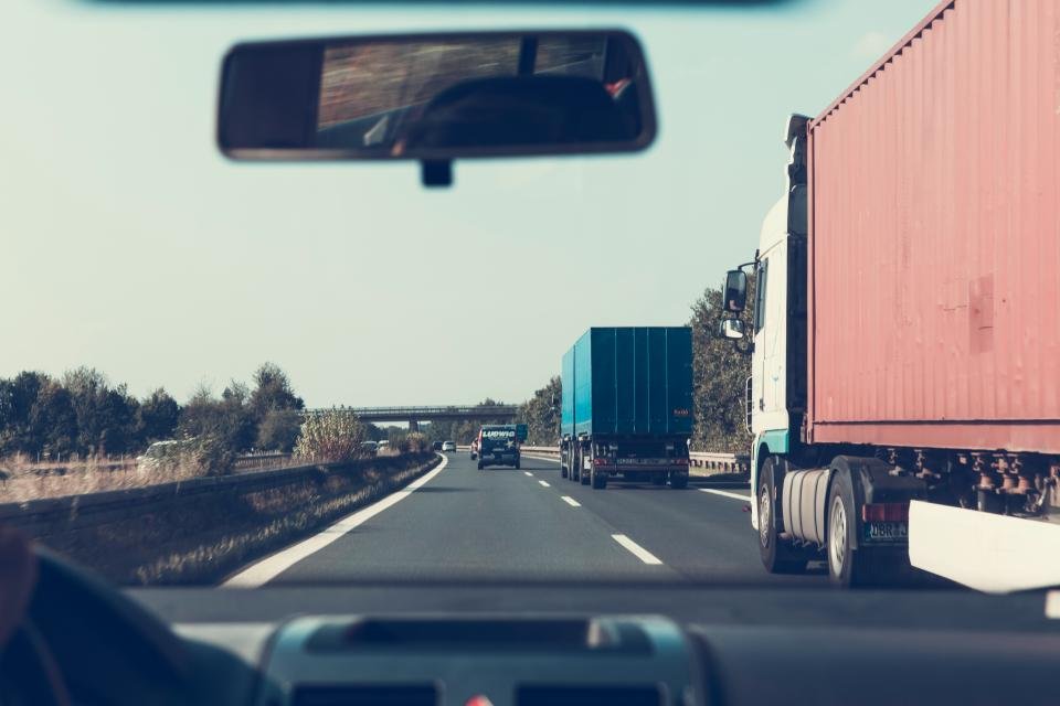 Semi trucks on the highway seen from a following vehicle
